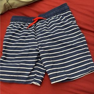 Striped swim trunks with red drawstring